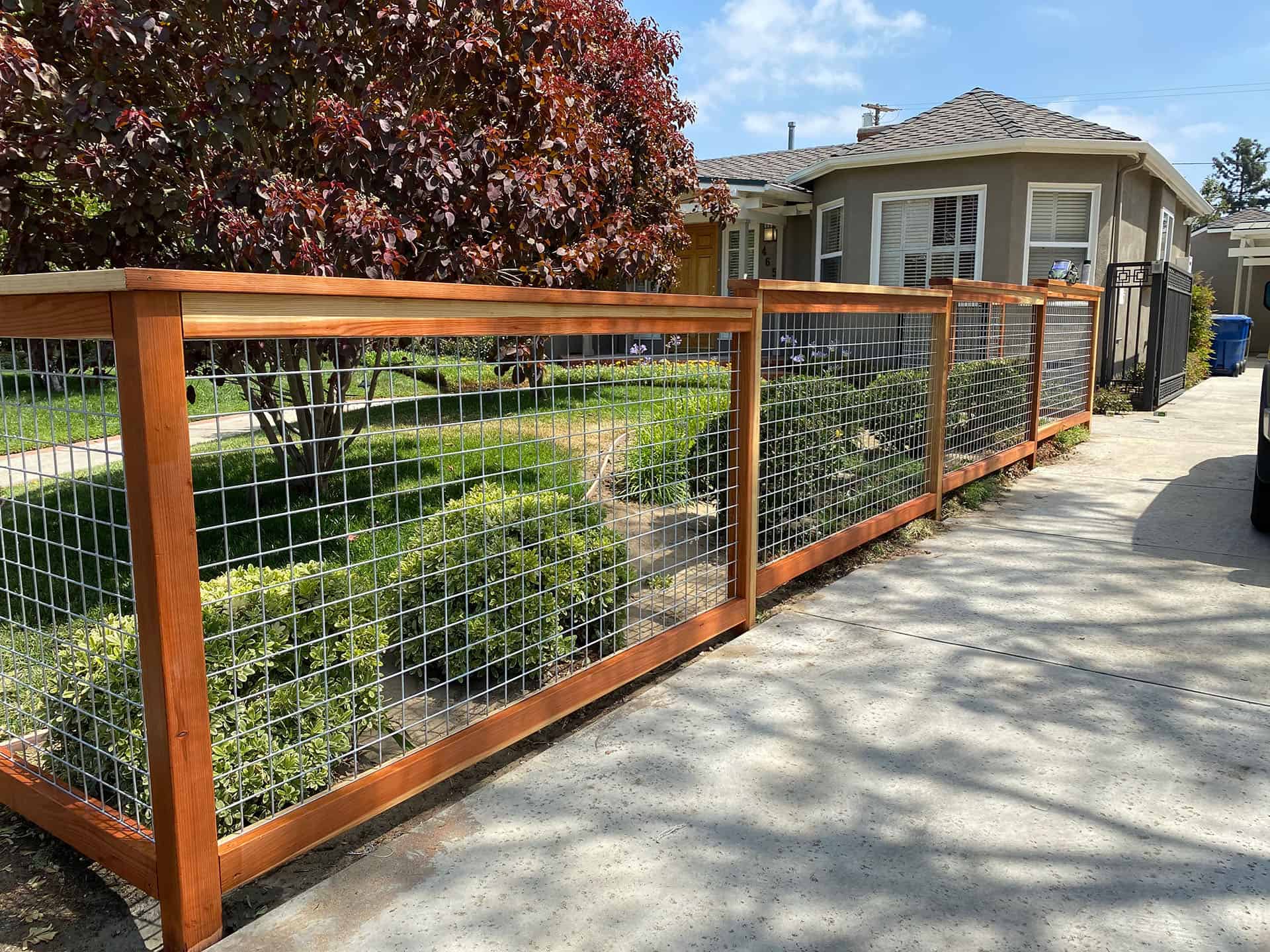 Hog wire panel in a stained redwood frame