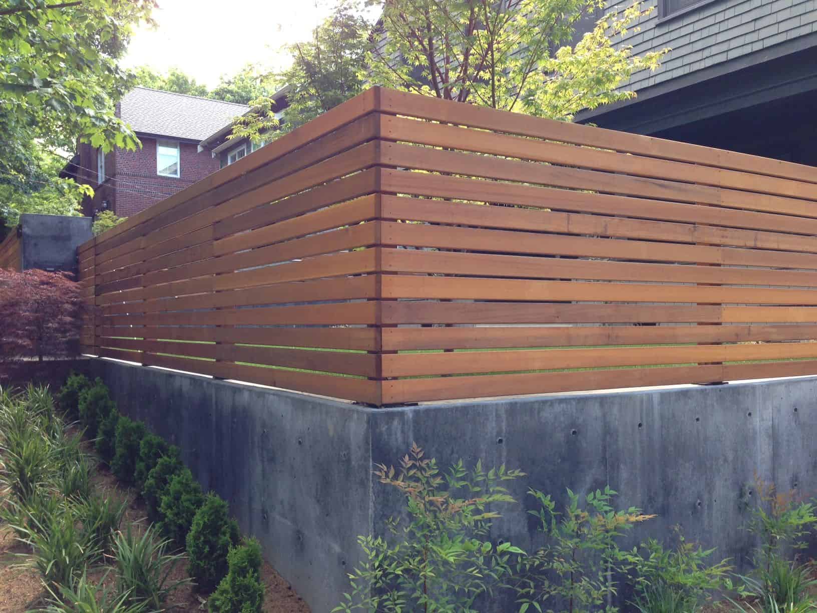 Horizontal ipe slat fence on a concrete base