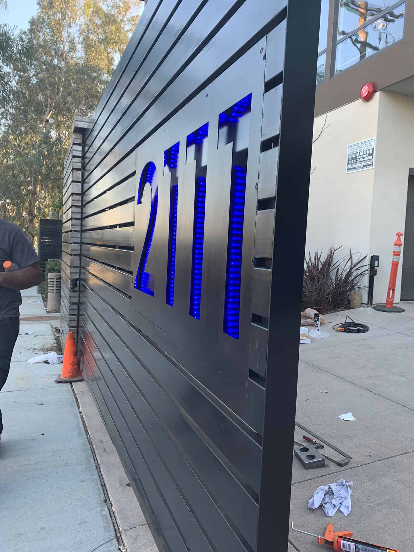 Stainless gate with lit address numerals in Beverly Hills